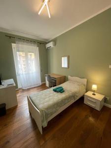 Postel nebo postele na pokoji v ubytování T-Rooms