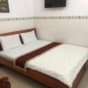 Voodi või voodid majutusasutuse Happy 1 Hotel Binh Duong toas