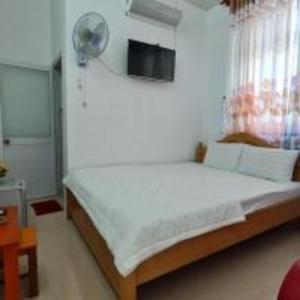 Giường trong phòng chung tại Happy 1 Hotel Binh Duong