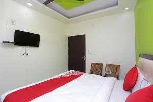 Katil atau katil-katil dalam bilik di Hotel O Raj Palace