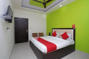 Katil atau katil-katil dalam bilik di Hotel O Raj Palace