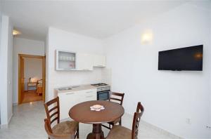 Kuchyň nebo kuchyňský kout v ubytování Apartments Pisac