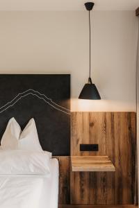 Postel nebo postele na pokoji v ubytování Hotel Neubergerhof