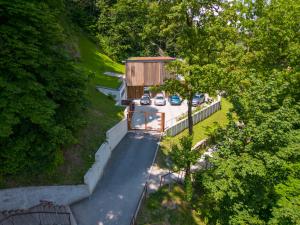 an overhead view of a house with cars parked in a driveway at Studio na Stolbi in Ljubljana