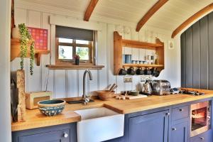 a kitchen with a sink and a counter top at The Garden Rooms at Lonton in Durham