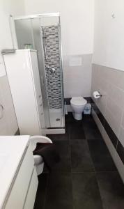 a bathroom with a shower and a toilet in it at Apartaments "Le vele 1" in Pachino