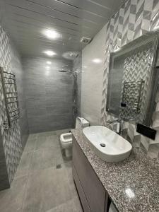 a bathroom with a sink and a toilet at ZAK Home in Gyumri