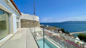 a balcony of a house with a view of the ocean at CAP DE LA BARRA 61 - Villa deluxe vista mar in L'Estartit