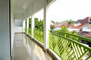 a balcony with a view of the city at Capital O 92804 La Tansa Syariah Hotel in Cibeber