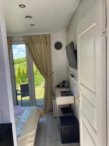 TV a/nebo společenská místnost v ubytování MMA apartament
