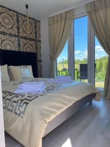 Postel nebo postele na pokoji v ubytování MMA apartament