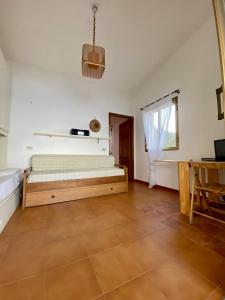 Ένα ή περισσότερα κρεβάτια σε δωμάτιο στο Casa Fadda