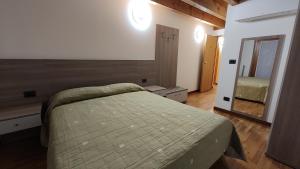 Postel nebo postele na pokoji v ubytování Wine Resort