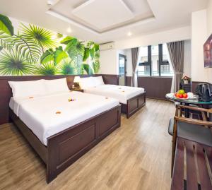 Postel nebo postele na pokoji v ubytování Azura Gold Hotel & Apartment