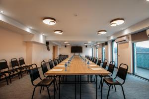 a conference room with a long table and chairs at Gino Seaside Tbilisi, Trademark Collection by Wyndham in Tbilisi City