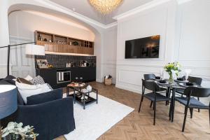 a living room with a couch and a dining room at Luxury Accommodation In The City Centre With Free Parking in Bournemouth