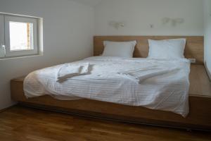 Postel nebo postele na pokoji v ubytování Apartmani Vinarije IN + 18 fotografií