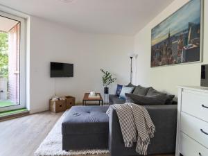 Μια τηλεόραση ή/και κέντρο ψυχαγωγίας στο Home by Doni I Apartment an der Kunsthalle I Parkplatz & Balkon