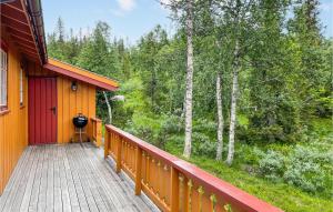 a porch of a house with a view of the woods at Beautiful Home In Eggedal With House A Mountain View in Kleiv