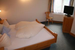 Postel nebo postele na pokoji v ubytování Haus Oberland