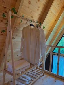 a jacket hanging on a rack in a attic at Sun House in Batumi