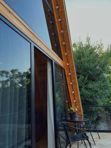 a patio with a table and chairs on a balcony at Sun House in Batumi