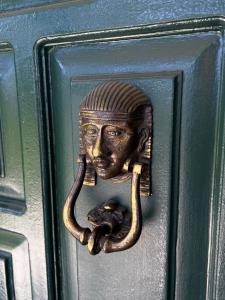 a brass door knob with a head and a snake at TRABZON VILLA l in Trabzon
