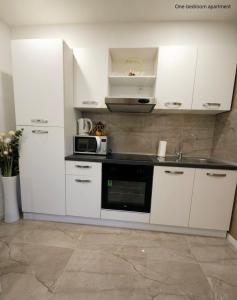 Kuchyňa alebo kuchynka v ubytovaní Apartments Sinković