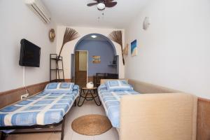 Posteľ alebo postele v izbe v ubytovaní Mare Nostrum Apartments