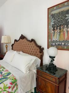 Postel nebo postele na pokoji v ubytování La Dolce Vita a Positano boutique hotel