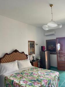 Postel nebo postele na pokoji v ubytování La Dolce Vita a Positano boutique hotel