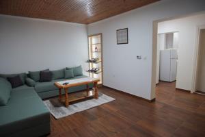 a living room with a couch and a table at House for rest in Mostar