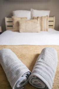 Katil atau katil-katil dalam bilik di Coquette maison & extérieur