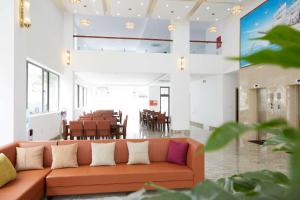 a living room with a couch and a table at TQ Hotel & Apartment in Hai Phong