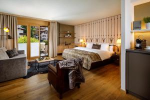 Postel nebo postele na pokoji v ubytování Hotel Piz Buin Klosters