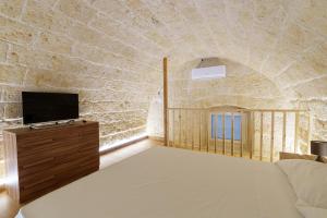 Giường trong phòng chung tại Scaringi Central Apartment