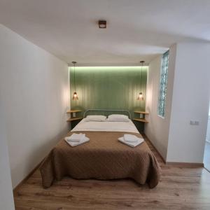 Voodi või voodid majutusasutuse River House Boutique Hotel toas