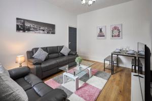 a living room with a couch and a table at Host & Stay - Belford Apartment in North Shields