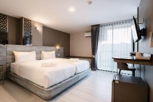 วัน บัดเจท เชียงราย เชียงแสน One Budget Hotel Chiangrai Chiangsaen客房内的一张或多张床位