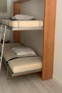 En eller flere senge i et værelse på Superbe studio à 100 mètres de la plage