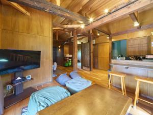 a living room with a couch and a table at Nasu YUU - 那須 悠- in Nasu-yumoto