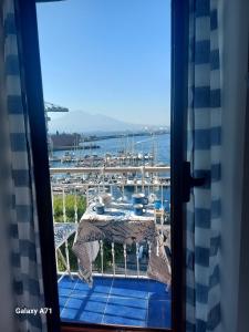 a view of a marina from a window at Coralinetiny in Castellammare di Stabia