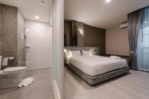 วัน บัดเจท เชียงราย เชียงแสน One Budget Hotel Chiangrai Chiangsaen客房内的一张或多张床位