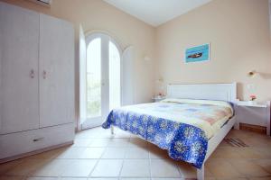 Postel nebo postele na pokoji v ubytování Residenza a due passi dal mare + 7 fotografií
