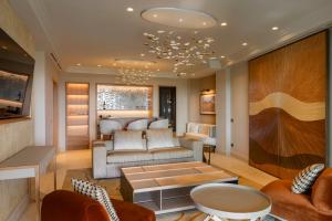 a living room with a couch and a table at Castelfalfi in Castelfalfi