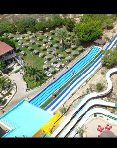 an overhead view of a pool at a water park at Golf house Marquesa in Rojales