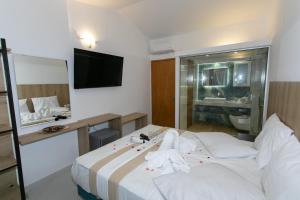 Postel nebo postele na pokoji v ubytování Hotel Philoxenia