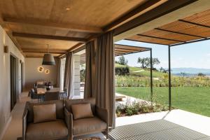 a living room with a view of a yard at Castelfalfi in Castelfalfi +121 photos