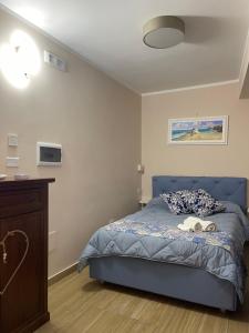 Кровать или кровати в номере Residenza le sirene