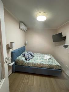 Кровать или кровати в номере Residenza le sirene